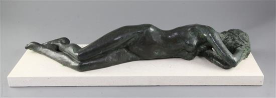 § Michael Cooper (Irish, b.1944). A bronze figure of a reclining nude sunbather, length 25in.